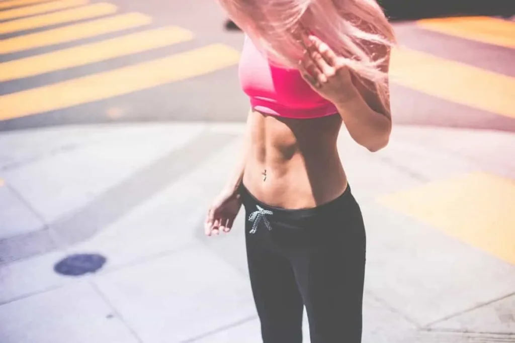 Woman with toned stomach after LA-EMS Body Sculpting Treatment New Malden